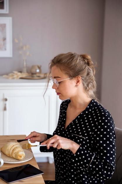 Front view of woman having breakfast