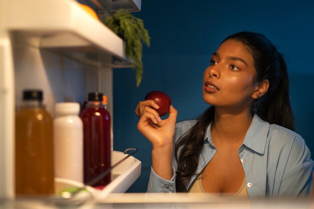 Front view woman holding apple