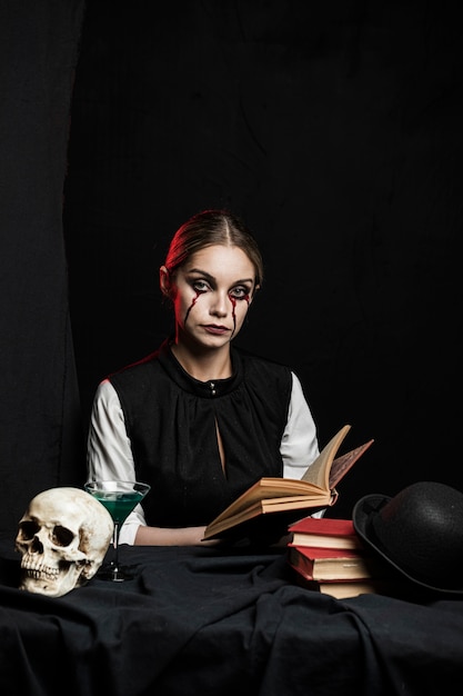 Free photo front view of woman holding book