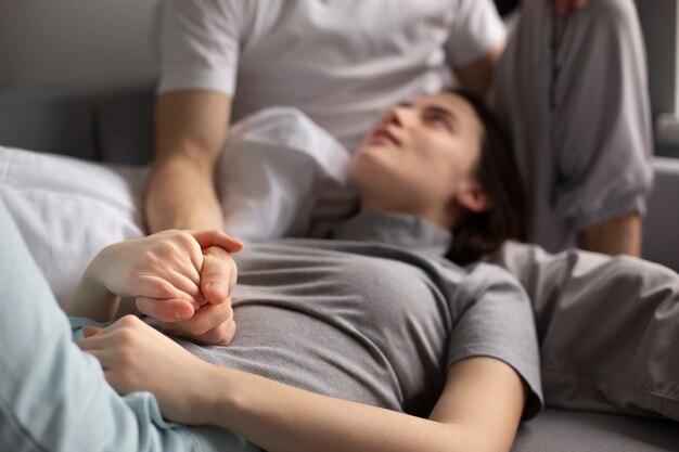 Front view of woman holding boyfriend's hand