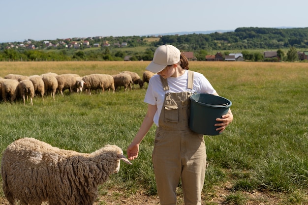 Free photo front view woman holding bucket