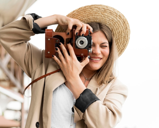 Front view woman holding camera