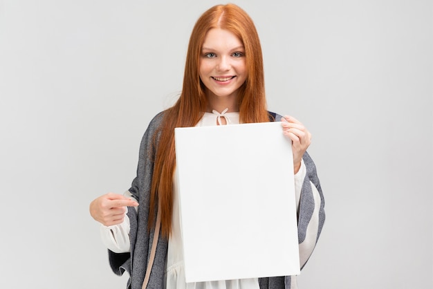 Front view woman holding canvas