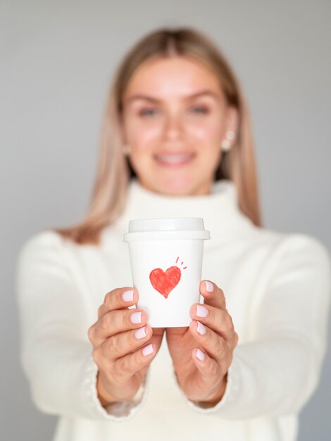 Front view woman holding coffee cup