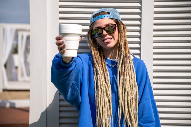 Front view woman holding coffee cup