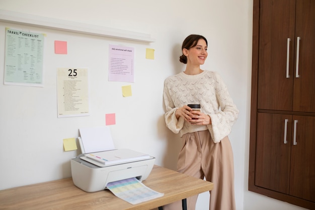 Free photo front view woman holding coffee cup