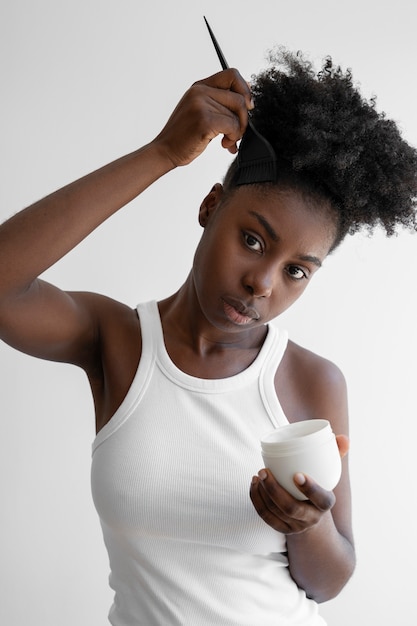 Free photo front view woman holding container