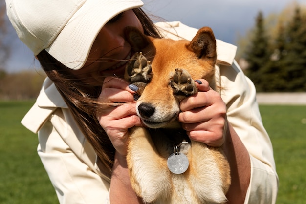 Front view woman holding cute dog