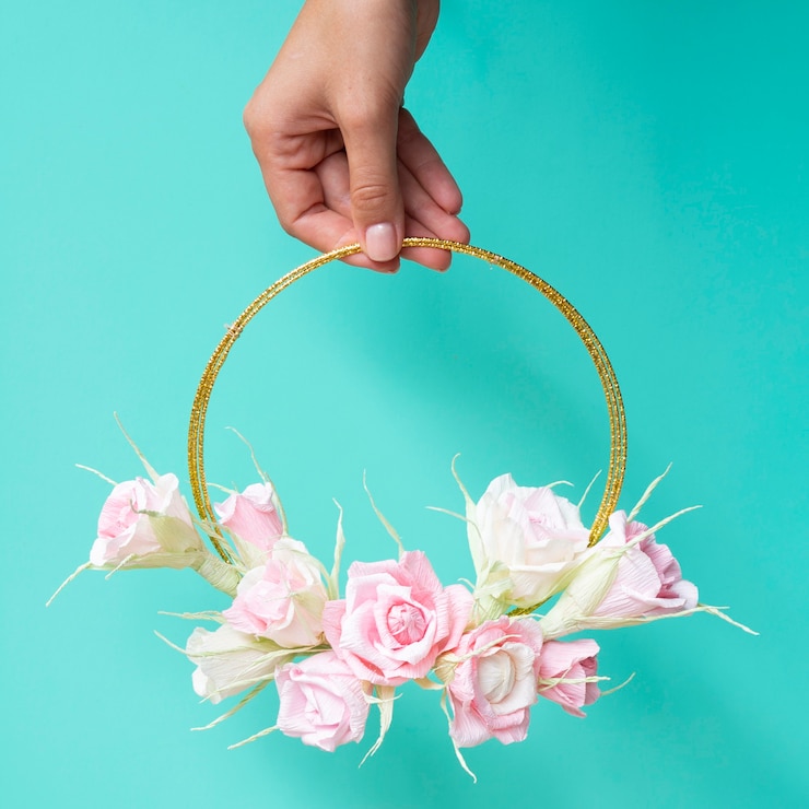 Free Photo front view woman holding a floral frame on blue background
