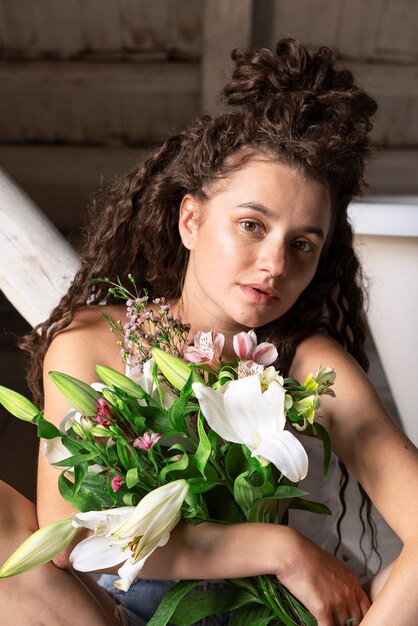 Front view woman holding flowers