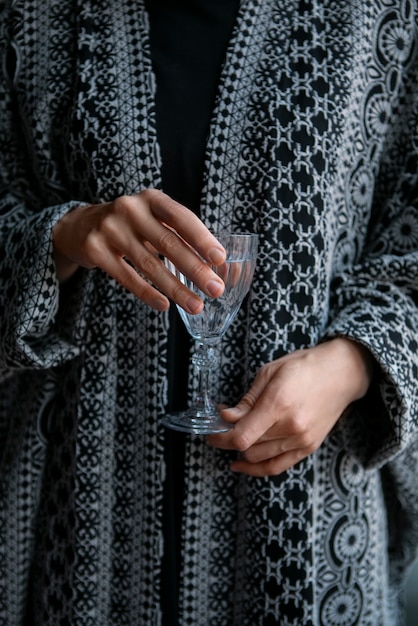 Front view woman holding glass