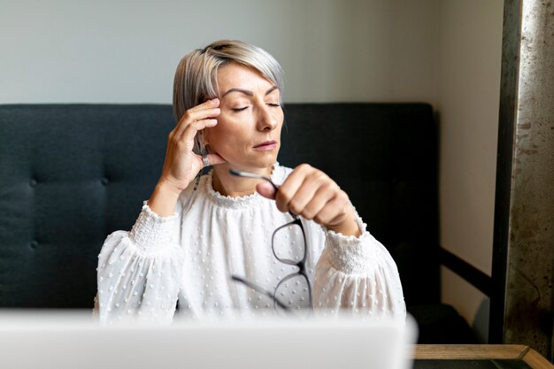 Front view woman holding glasses