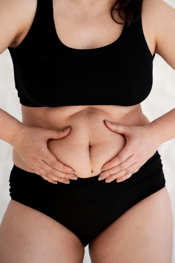 Free Photo front view woman holding her belly