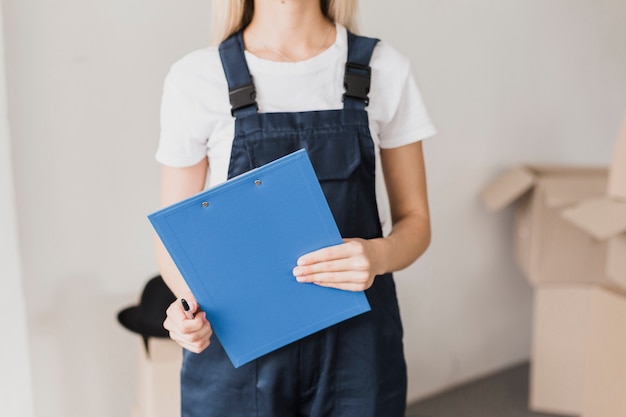 Front view woman holding paper clipboard