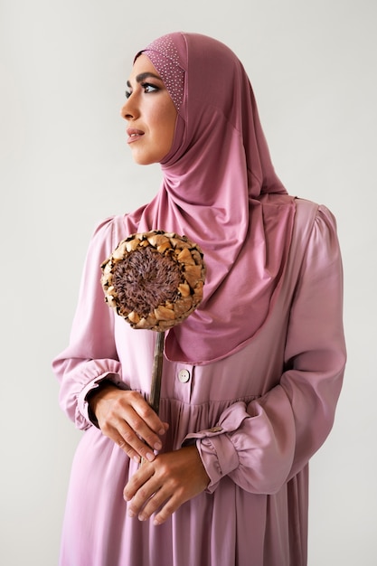 Front view woman holding plant