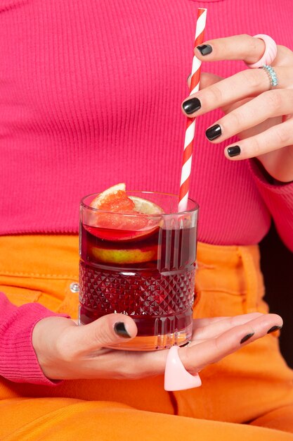 Front view woman holding sangria