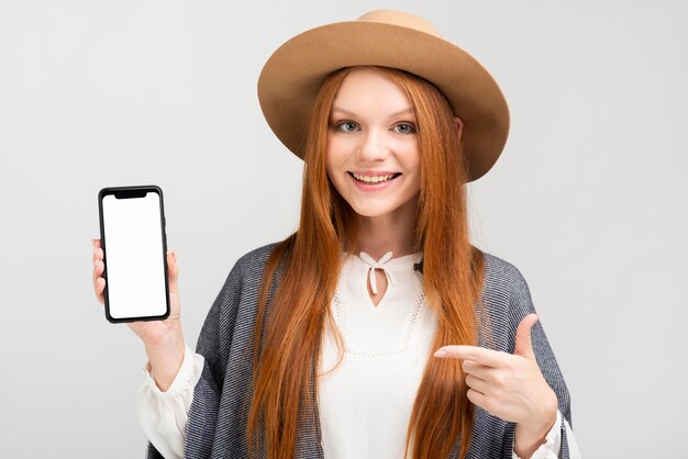 Front view woman holding smartphone