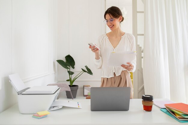 Front view woman holding smartphone