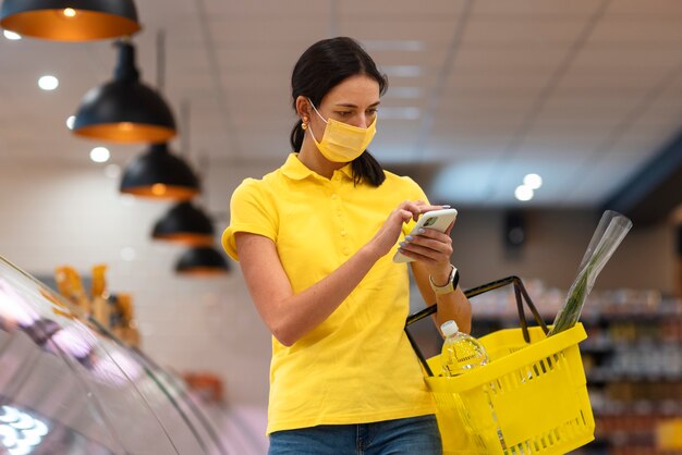 Front view woman holding smartphone