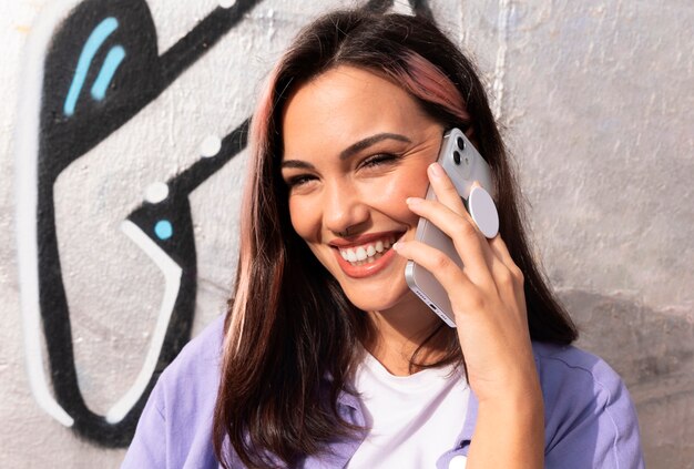 front view woman holding smartphone