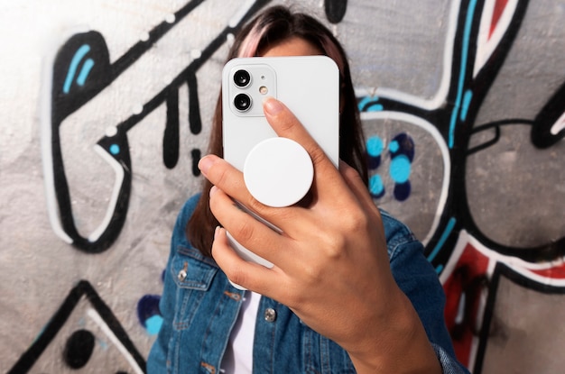 front view woman holding smartphone