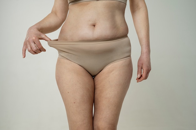 Front view woman holding underwear