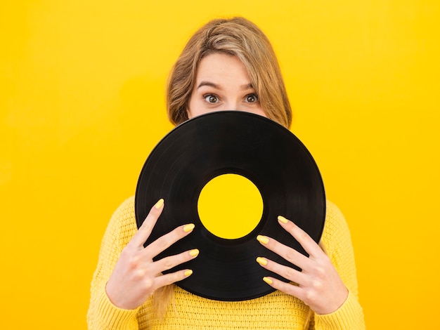 Front view woman holding vinyl
