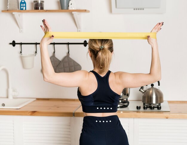 Front view woman at home working out