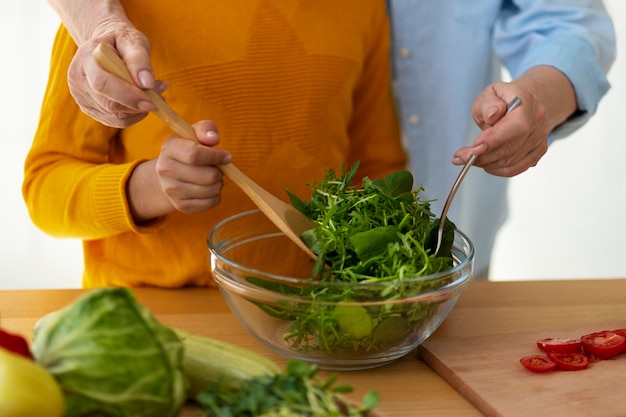 Free photo front view woman and kid cooking together