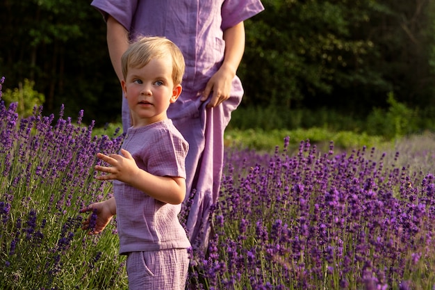 Free photo front view woman and kid in nature