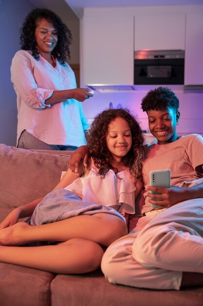 Front view woman and kids spending time at home