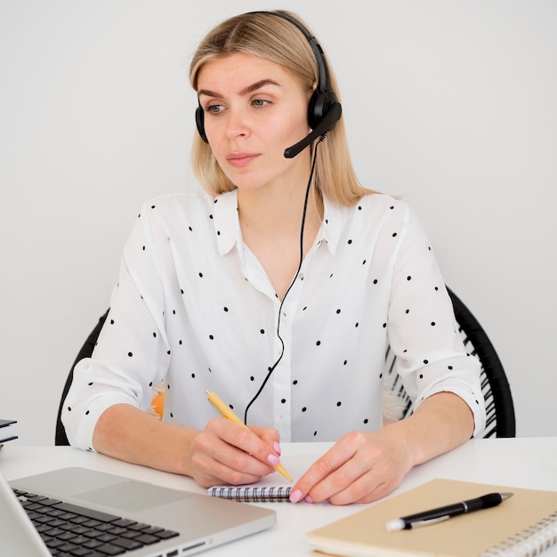 Front view woman learning from online courses