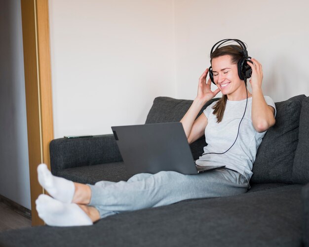 Front view of woman listening to music