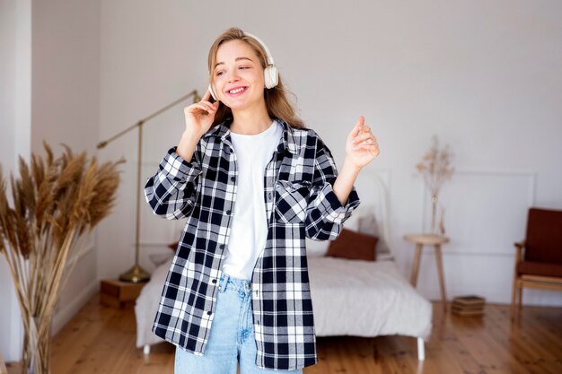 Front view of woman listening to music