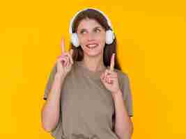 Free photo front view of woman listening to music