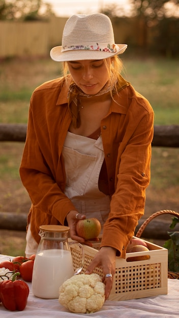 Front view woman living at farmhouse