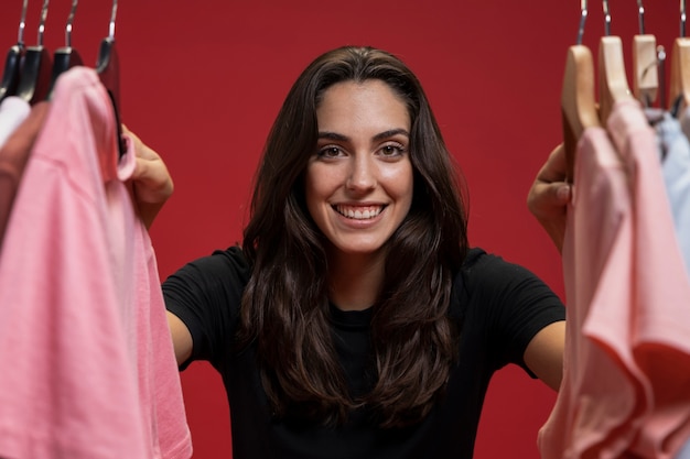 Free photo front view woman looking through clothes