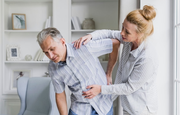 Front view woman and man with back pain