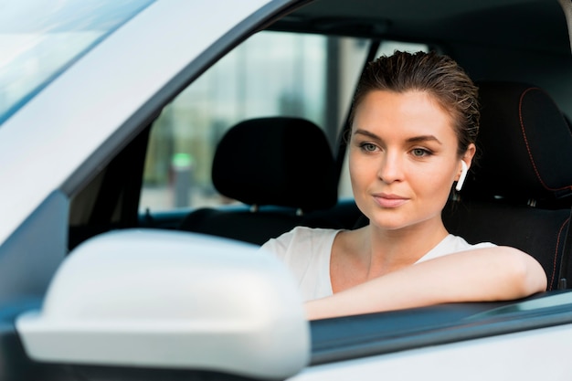 Front view of woman in personal car