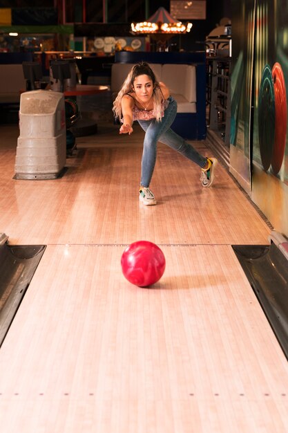 Front view woman playing bowling