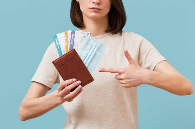 front view woman pointing some airplane tickets 23 2148596895.jpg?size=626&ext=jpg&ga=GA1.2.616193228 - Pesan Tiket Pesawat di Tengah Pandemi? Baca Tips Mudahnya Berikut!