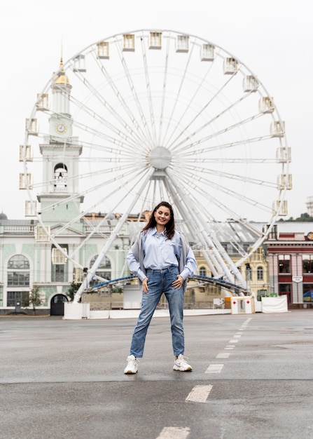 Front view woman posing in an amusement park