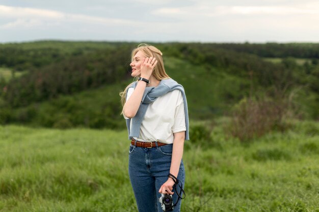 Front view on woman posing outdoors