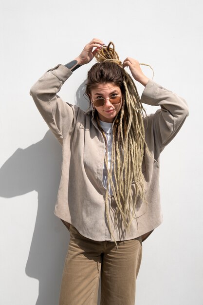 Front view woman posing with afro dreadlocks