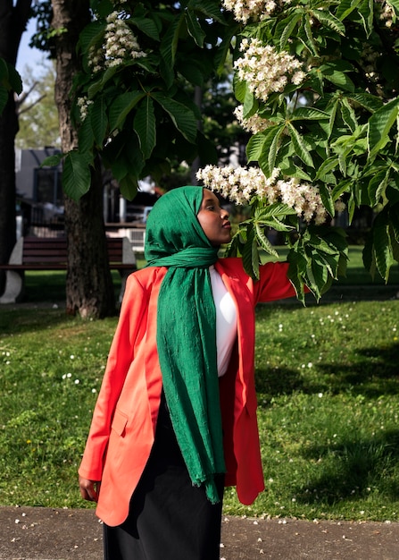 Front view woman posing with beautiful flowers