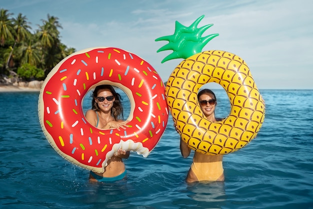 Free photo front view woman posing with floaters