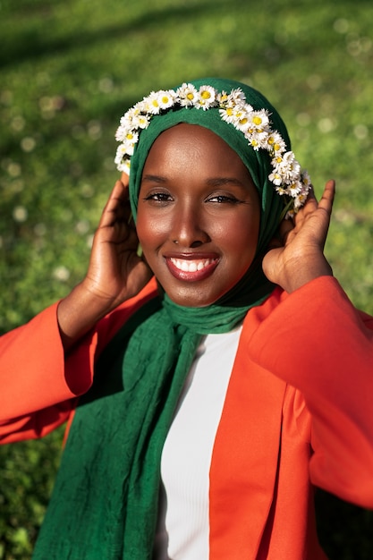 Front view woman posing with floral wreath