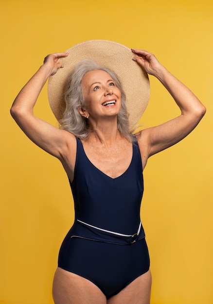 Free photo front view woman posing with hat