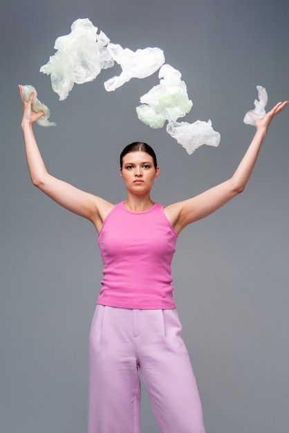 Front view woman posing with plastic bags