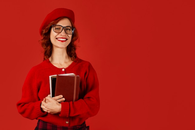 Free photo front view woman posing with red outfit